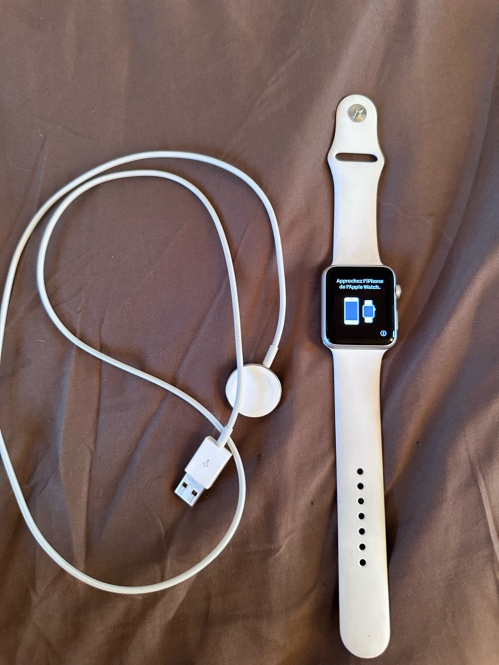 Apple watch with White Silicone Band and charger cable - series 1